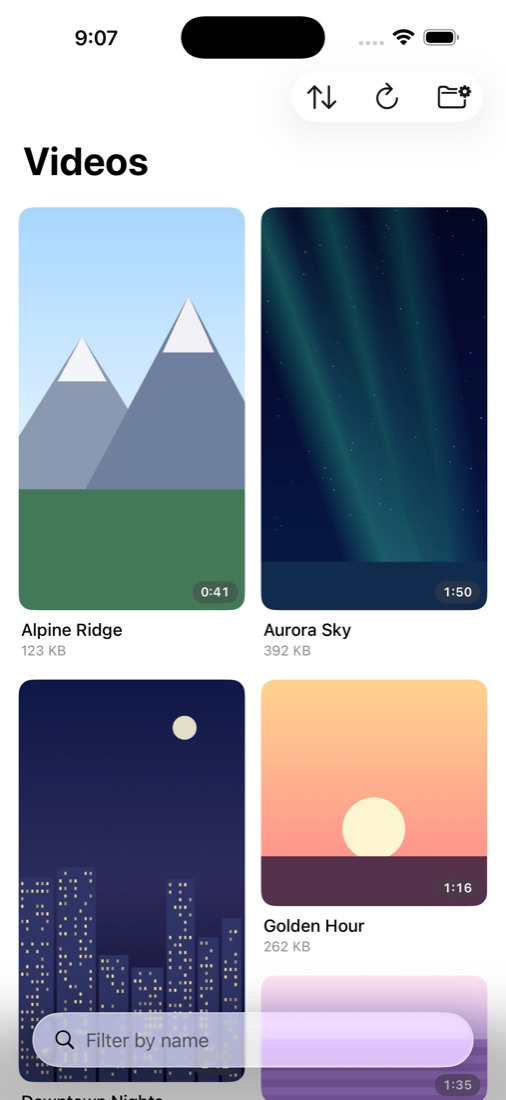 Video library on iPhone showing thumbnails from a USB-C drive, organized by folder